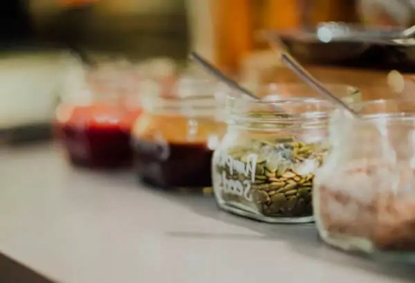 Containers of spices, rubs and sauces