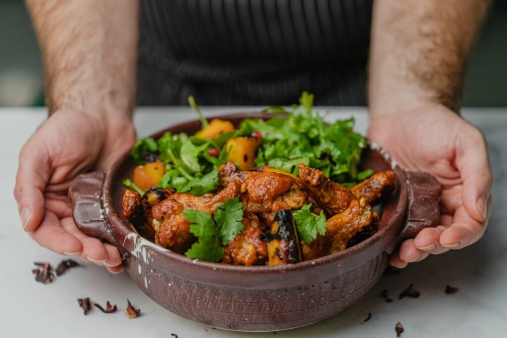 Griffith Chef presenting a finished dish that came from our FlavorIQ process.