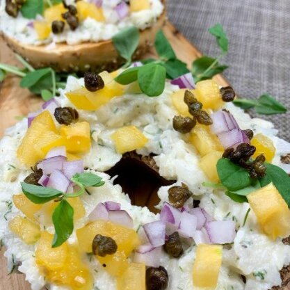 Hearts of palm is used in a whitefish salad for a plant-based bagel sandwich.