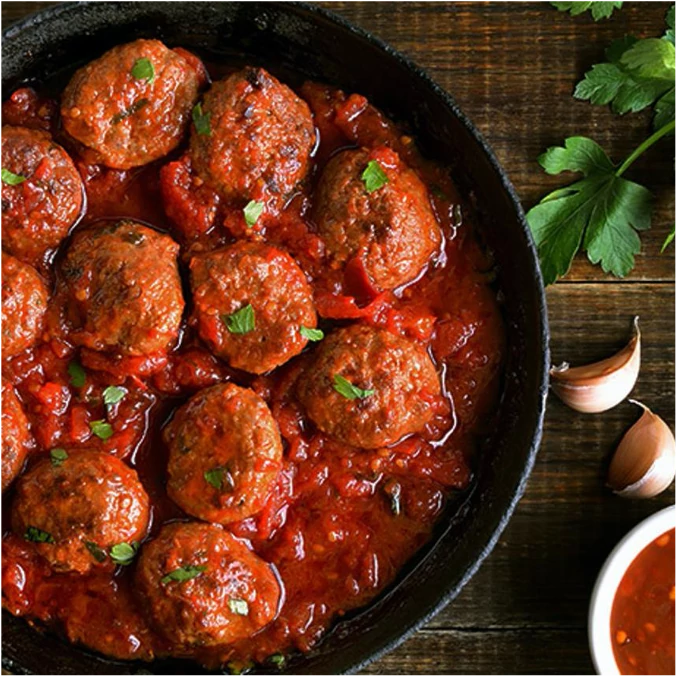 Griffith's meatless meatballs made with vegetable protein. Stuffed with hard-boiled egg, simmered in a smoky chipotle broth.