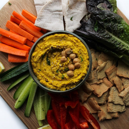 A feel-good immune-boosting Ginger Turmeric, Moringa Blend mixed with chick peas, tahini and olive oil