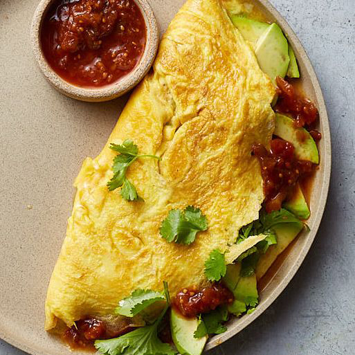 An egg white omelet served with traditional Mexican sauce is a convenient breakfast.