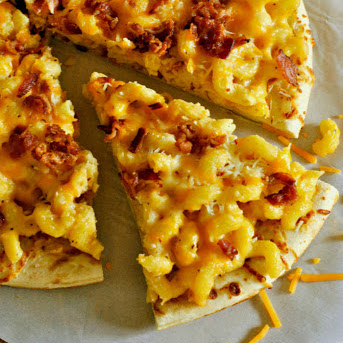 Traditional pizza topped with mac and cheese and bacon for a comforting twist.