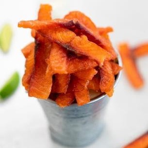 Salmon jerky is dry-cured and finished with a bold smoky and tangy chipotle lime seasoning.