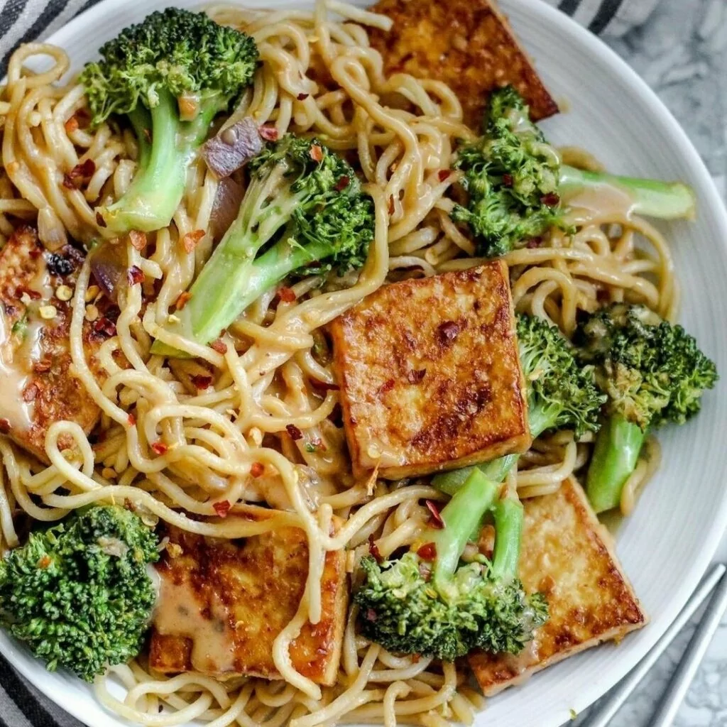 Baked garlic chili tofu with noodles and peanut sauce