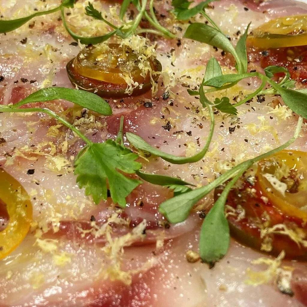 Stripped Bass Carpaccio with yuzu salt, garlic oil and lemon zest