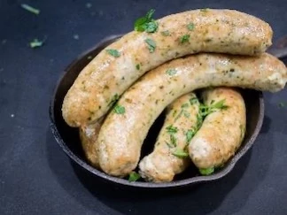 Ground chicken sausages blended with feta and a seasoning made of spinach and moringa powder.