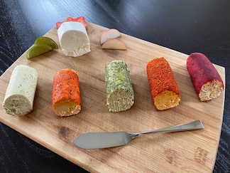 Goat cheese rolled in trendy seasonings and topicals.