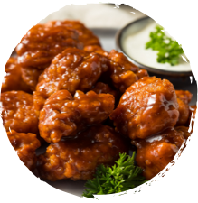 A batch of wings made in an air fryer using a Griffith Foods Flavour Glaze sauce.