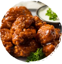 A batch of wings made in an air fryer using a Griffith Foods Flavour Glaze sauce.