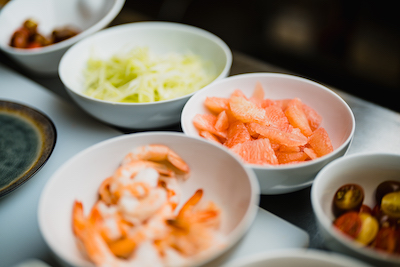 Bowls of prepped food, ready to cook with.
