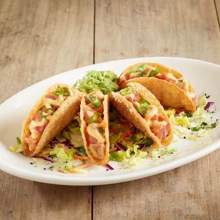 Mini tacos using sashimi-grade shrimp and crispy wonton shells.