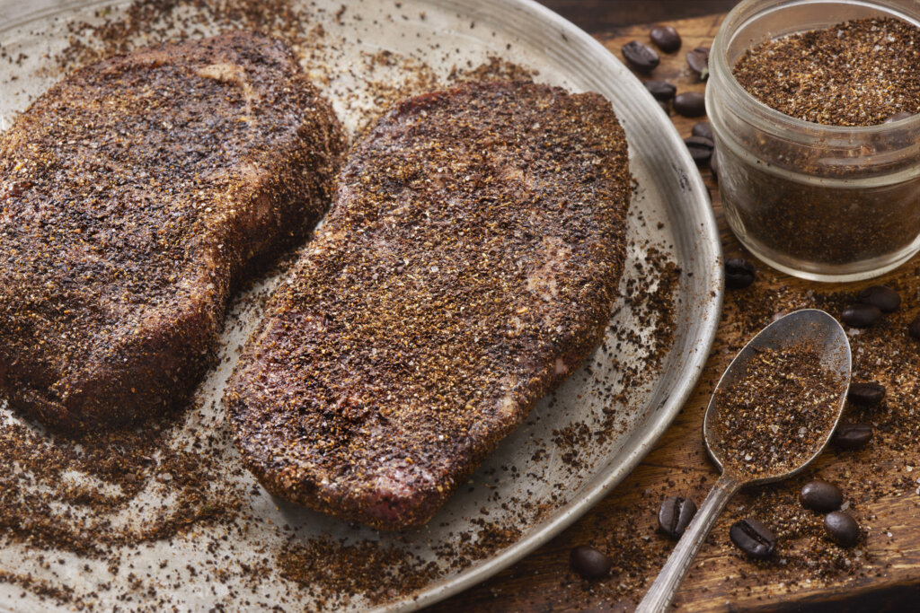 Preparing Coffee Dry Rubbed Boneless Rib Eye Steaks stock photo